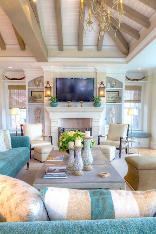 Living Room with Exposed Ceiling Beams and Teal Sofa Decor