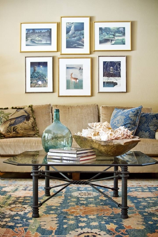 Living Room with Symmetrical Gallery Wall and Glass Top Coffee Table