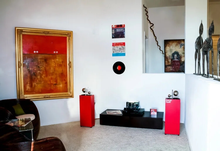 Loft Living Room with Red Speakers: Eclectic Style & Rattan Chair