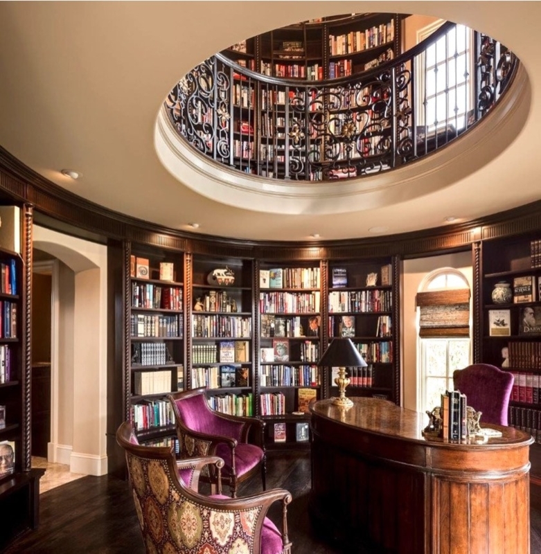 Luxurious Home Library: Two Story Circular Design & Ornate Iron Railing