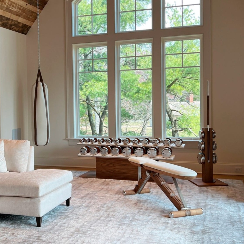 Luxury Home Gym Featuring Cream Punching Bag And Wood Accents