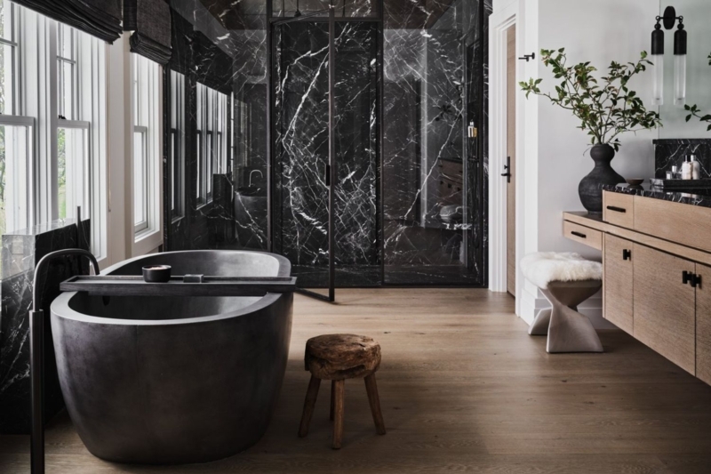 Luxury Master Bathroom with Veined Black Marble & Matte Charcoal Tub