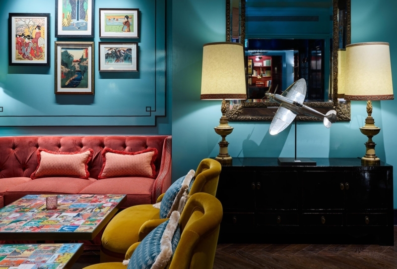 Maximalist Lounge: Teal Walls, Tufted Velvet Sofa, Herringbone Wood Floor