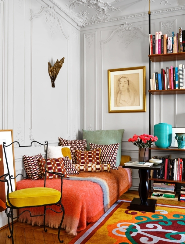Maximalist Reading Nook with ornate wall paneling and eclectic decor.
