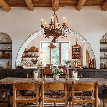 Mediterranean Dining Room: Stone Tiled Arch & Rustic Iron Candelabra