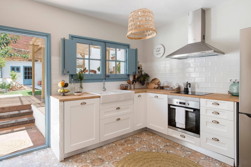 Mediterranean Kitchen: Blue Window Shutters & Patterned Floor Tile