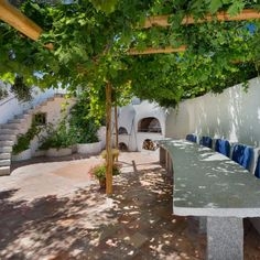 Mediterranean Patio Dining Area with Vine Pergola