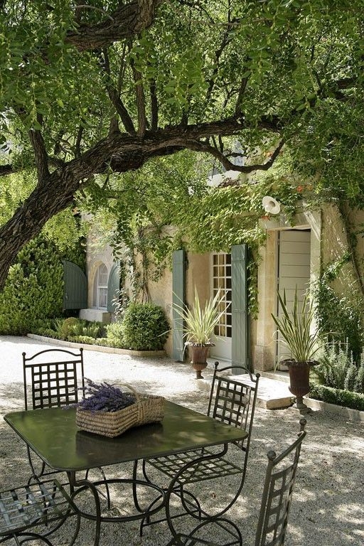 Metal Patio Dining Set with Grid Back Chairs on Gravel