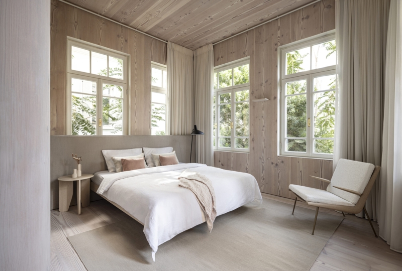 Minimalist Bedroom with Vertical Wood Wall Cladding