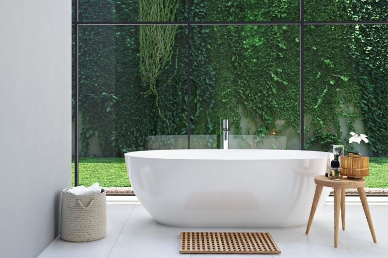 Minimalist Freestanding Bathtub with Vertical Garden Backdrop & View