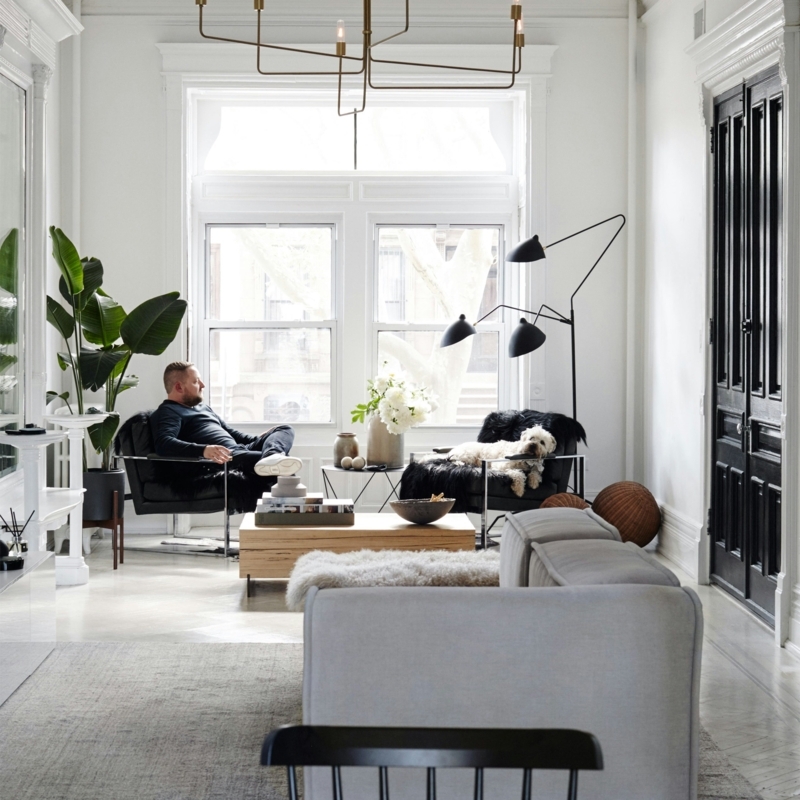 Minimalist Living Room Bay Window with Black Paneled Doors