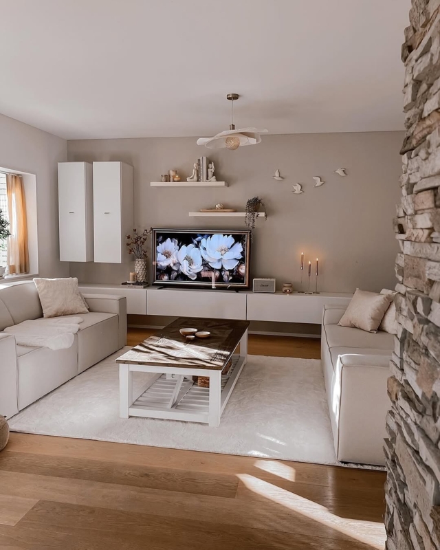 Minimalist Living Room: Cream Palette and Stone Wall