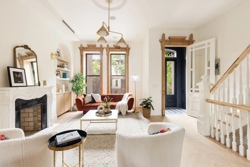 Modern Brownstone Living Room Decor Featuring A Rust Velvet Sofa
