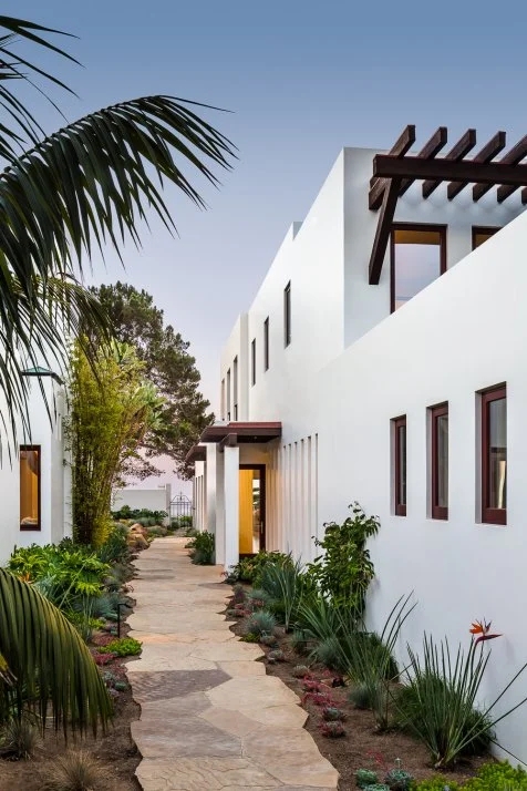 Modern Coastal Exterior White Stucco Facade Dark Wood Pergola