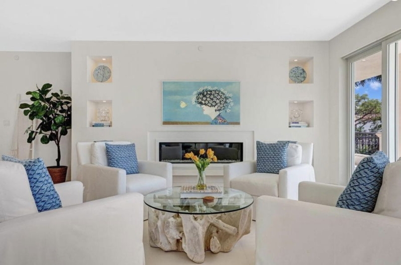 Modern Coastal Living Room with Driftwood Table & Four Chair Layout.
