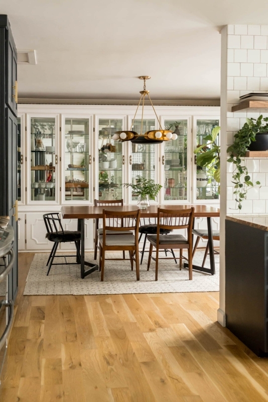 Modern Farmhouse Dining Room with built-in hutch and mismatched chairs.