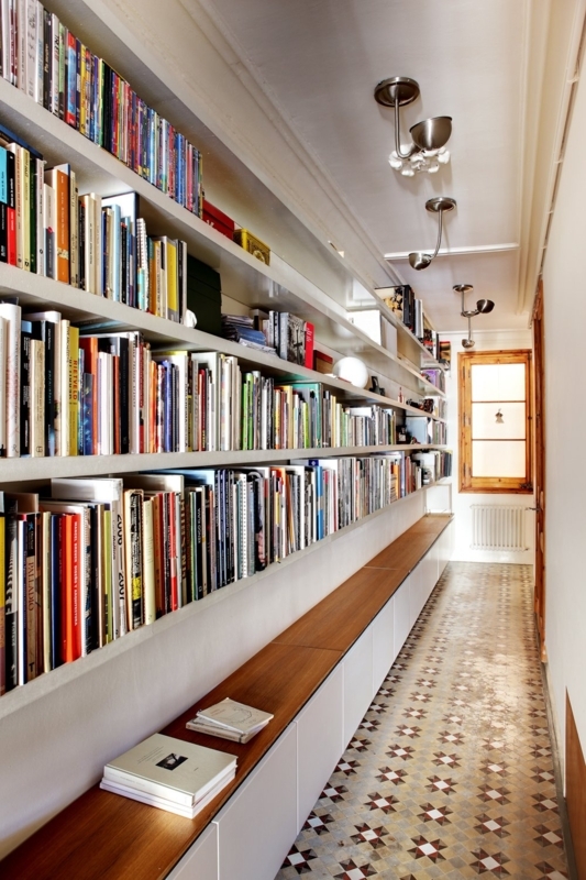 Modern Hallway Library with Patterned Mosaic Floor and Wall Shelves