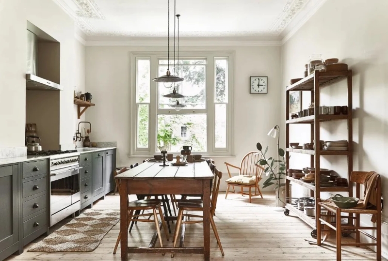 Modern Heritage Kitchen: Dark Green Cabinetry & Rustic Wooden Table
