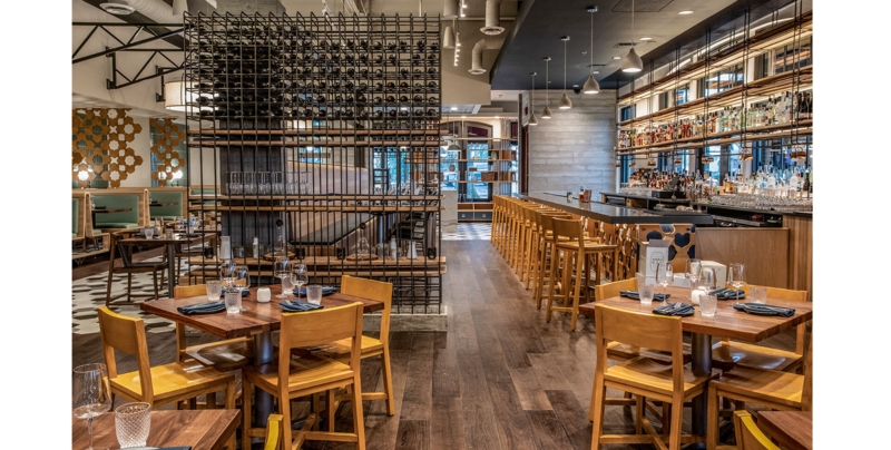 Modern Industrial Restaurant Design: Sculptural Wine Rack Divider