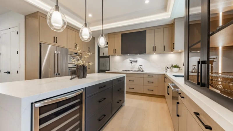 Modern Kitchen with Charcoal Island, Wine Fridge, and Teardrop Pendants