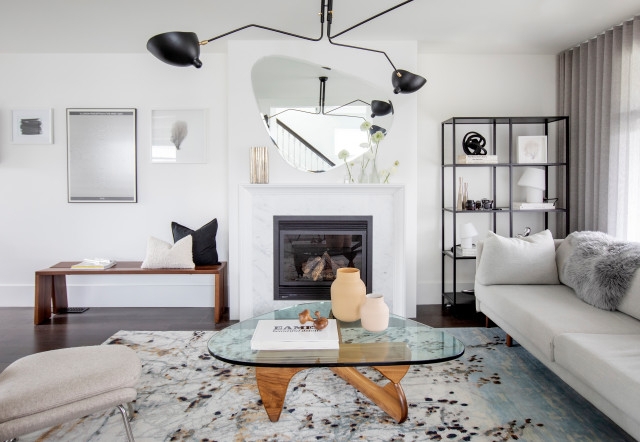 Modern Living Room: Asymmetrical Mirror & Glass Sculptural Coffee Table