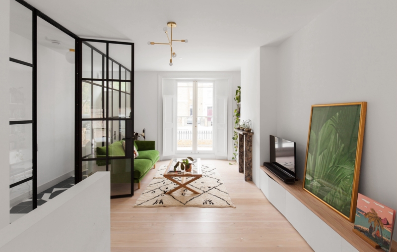 Modern Living Room: Green Velvet Sofa & Industrial Glass Partition Wall
