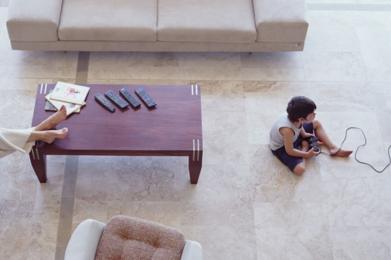 Modern Open Plan Living Area with Large-Format Tiles & Tan Sectional
