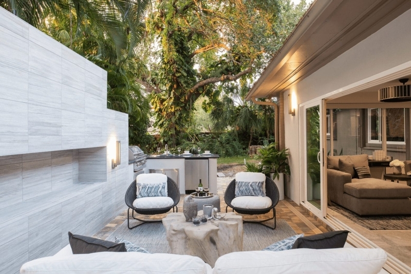 Modern Outdoor Patio with Monolithic Tiled Fireplace Wall