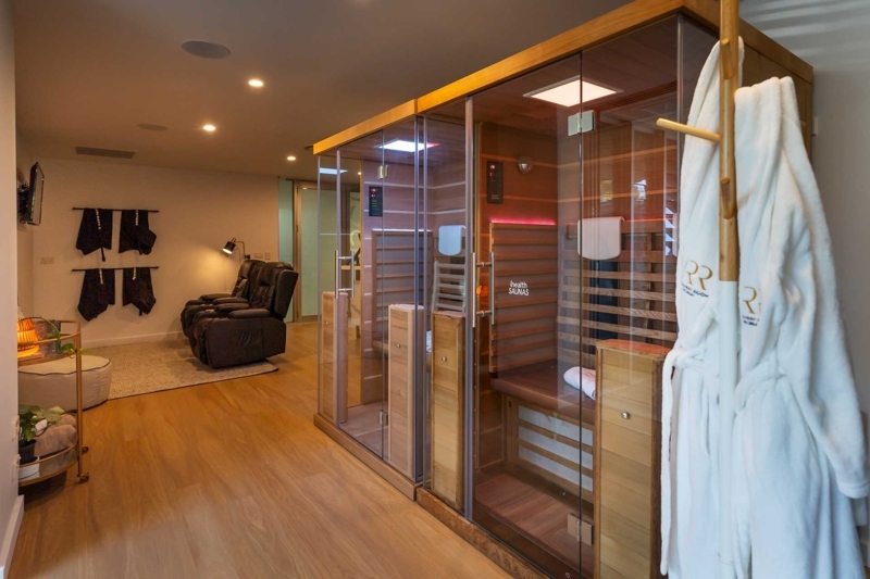 Modern Spa Wellness Room With Dual Sauna Setup And Glass Walls