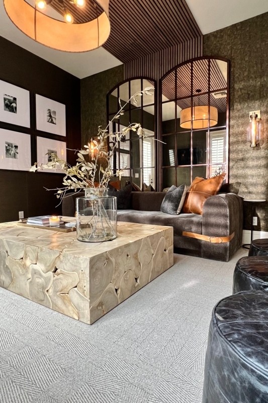 Moody Living Room with Large Wood Slab Coffee Table and Arched Mirrors