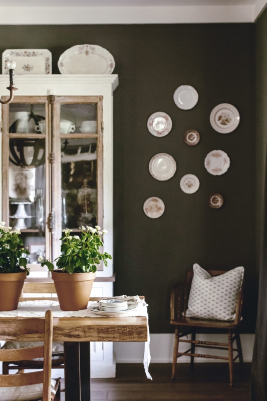 Moody Olive Green Dining Room with Circular Plate Wall Display