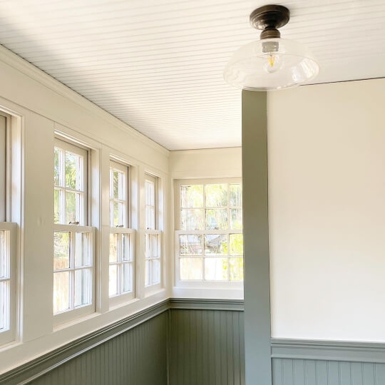 Mudroom with Beadboard Ceiling and Sage Green Wainscoting