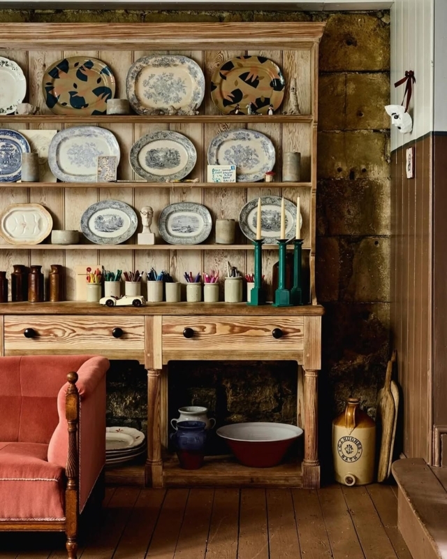 Natural Wood Hutch with Curated Plate Display & Stone Wall Backdrop