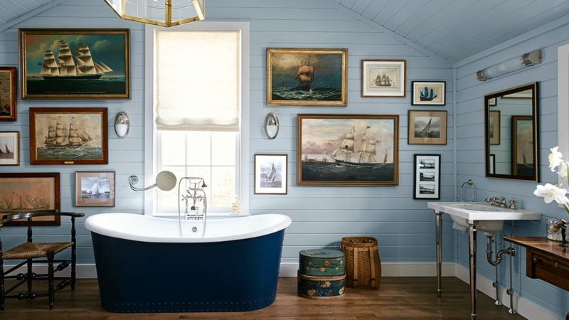 Nautical Bathroom with Navy Blue Tub, Shiplap Walls and Maritime Art
