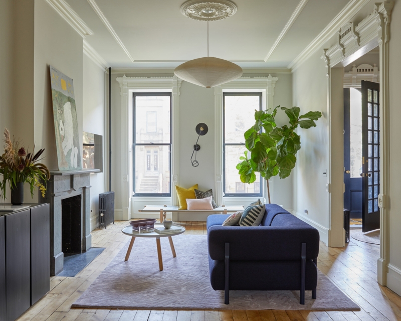 Navy Sofa Living Room with Tall Black Windows and Architectural Molding