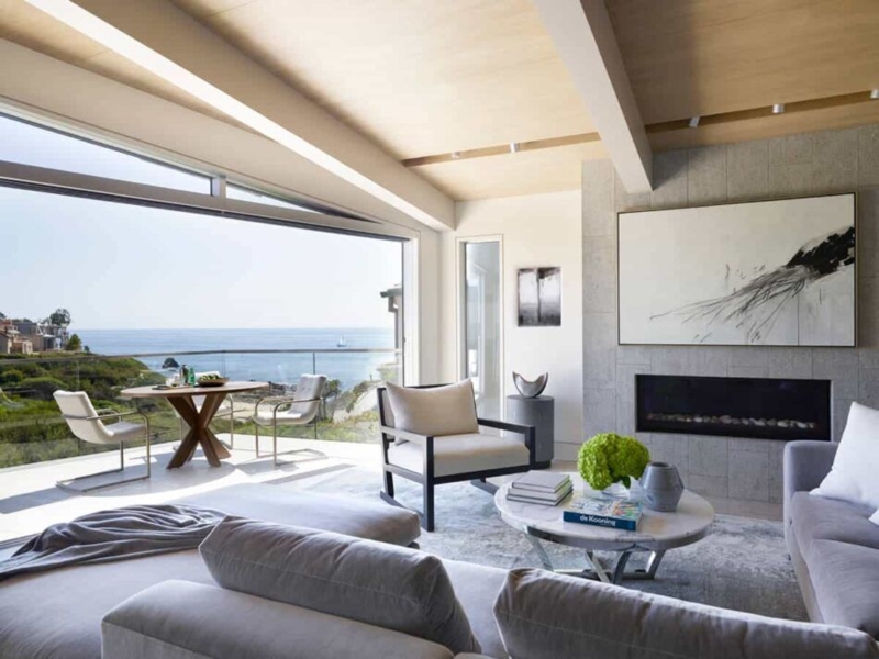 Oceanfront Lounge: Glass Walls & Architectural Wood Beams