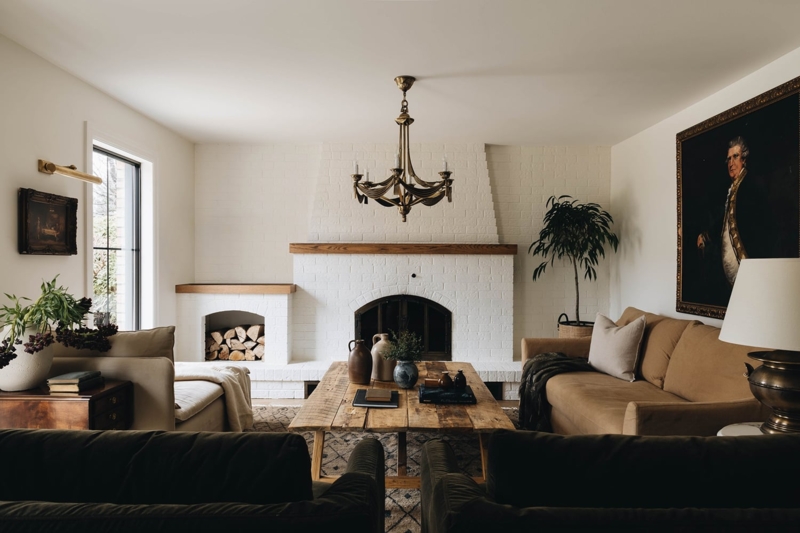 Old World Traditional Living Room with White Brick Fireplace & Plank Table