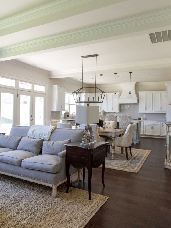 Open Concept Living Room Layout with Tiered Ceiling Molding