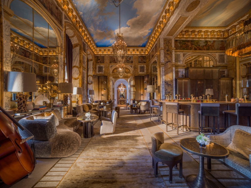 Opulent Hotel Bar: Sky Ceiling Mural, Gold Leaf Molding, Marble Features