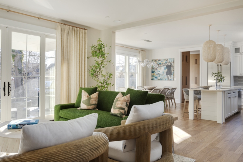 Organic Modern Open Space: Green Boucle Sofa & Reeded Accent Chairs.