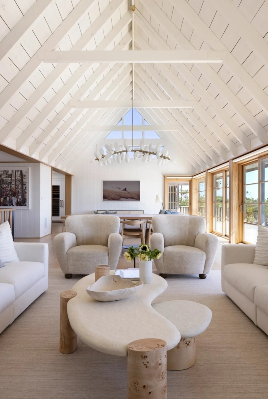 Organic Shaped Coffee Table in Coastal Room with Vaulted Plank Ceiling