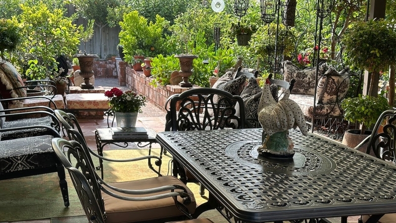 Ornate Dark Metal Outdoor Dining Set featuring Rooster Centerpiece