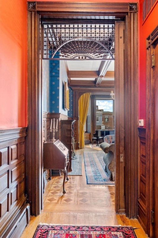 Ornate Sunburst Spindle Transom Design Near Grand Coffered Ceiling