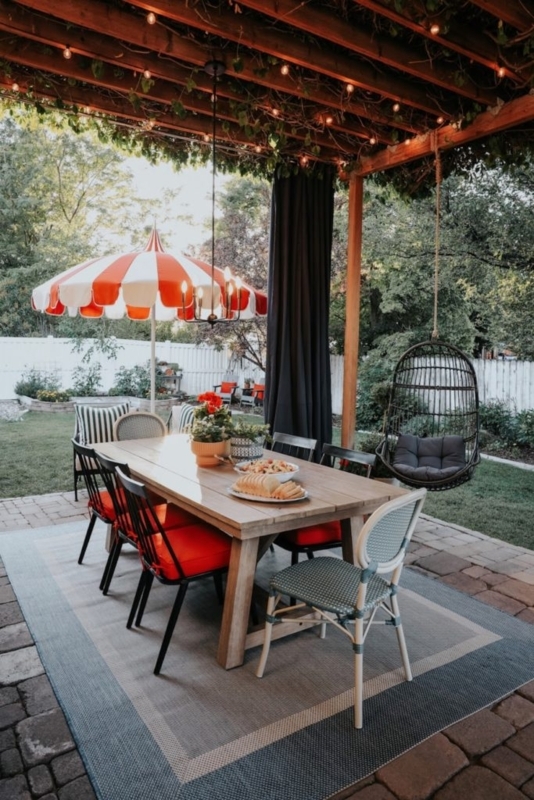 Outdoor Dining Area under Pergola with Striped Cafe Umbrella