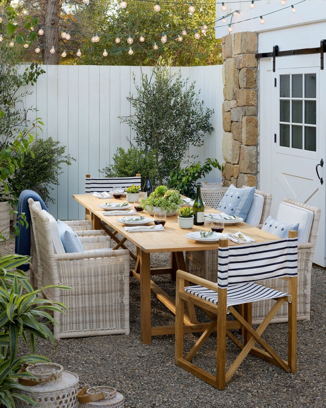 Outdoor Dining Set featuring Navy Striped Director Chairs and Globe Lights