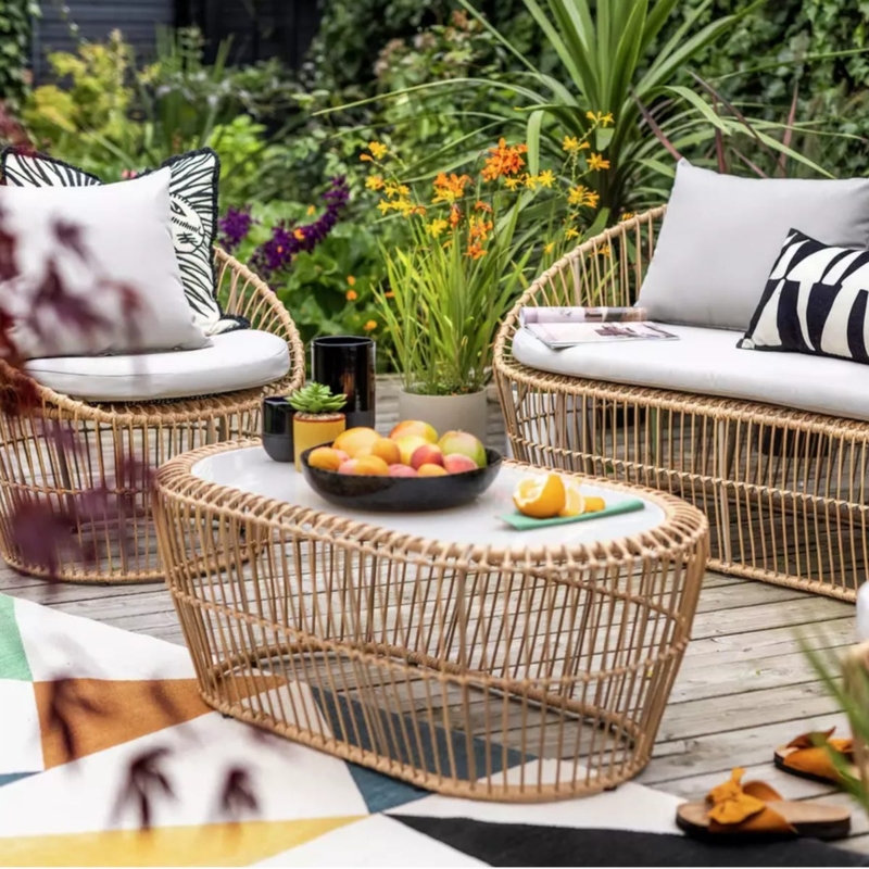 Patio Furniture Set featuring Airy Silhouette and Bold Geometric Rug