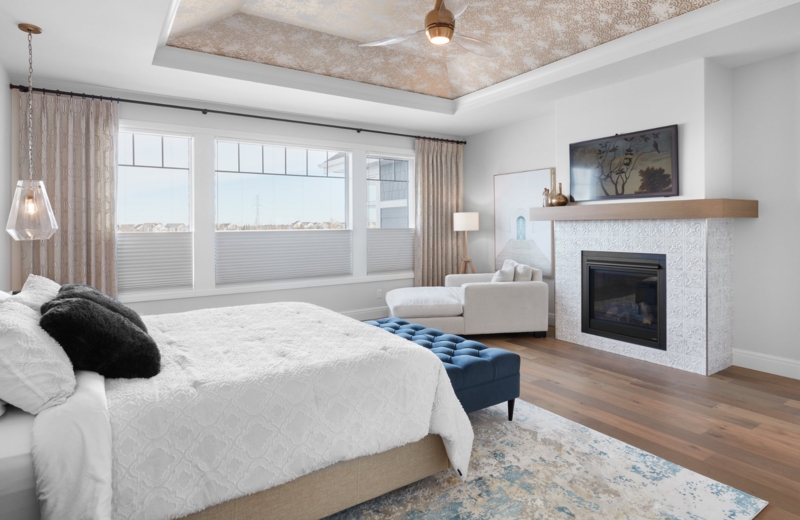 Primary Bedroom Suite with Patterned Tray Ceiling & Tiled Fireplace