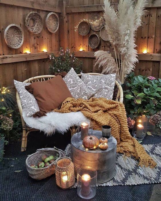 Rattan Loveseat with Layered Textiles for Cozy Autumn Patio Seating