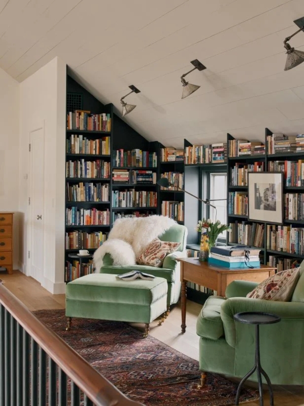 Reading Nook Attic Library with Sloped Bookshelf Design and Velvet