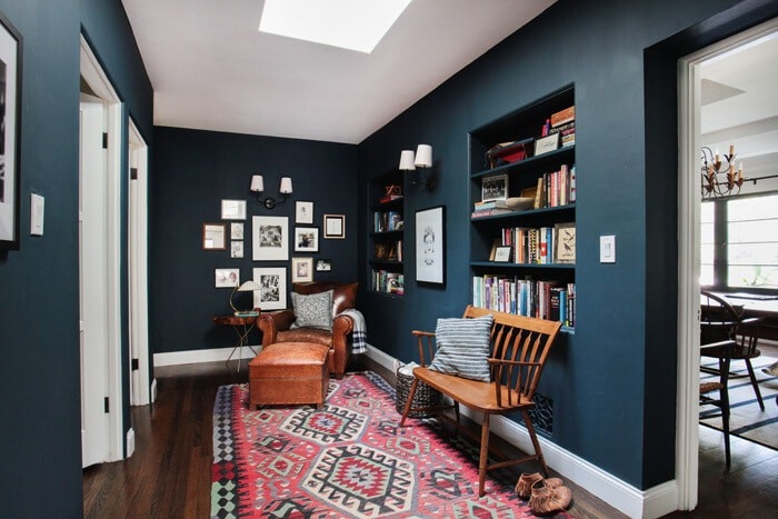 Reading Nook Eclectic Style with Navy Walls and Geometric Area Rug